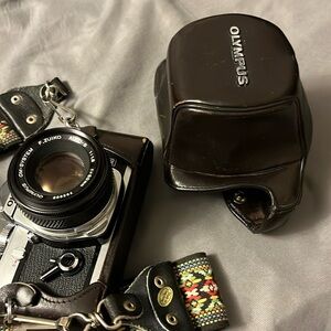 Old Olympus camera with strap and case.  Hasn’t been used for 3 years…